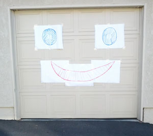 giant smiley face on garage door